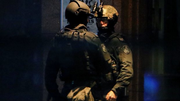 NSW Tactical Operations officers at the scene of the siege on Monday night. 