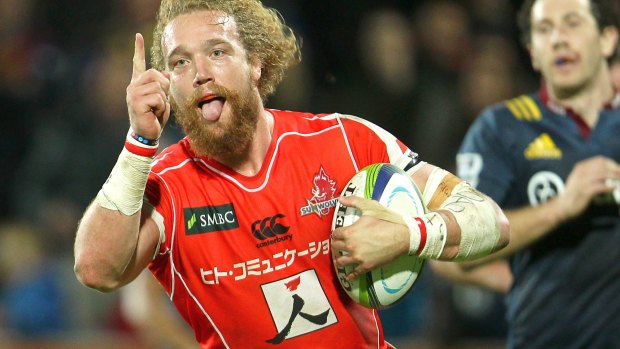 Happy days: Willem Britz runs in to score for the Sunwolves.