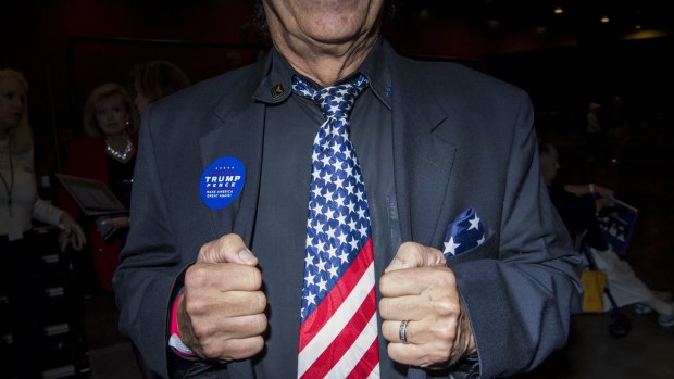 An attendee wears an American flag neck tie at a campaign event for Donald Trump.