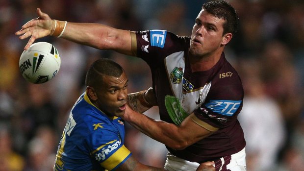 Ball spilled: Darcy Lussick of the Sea Eagles tries to offload.
