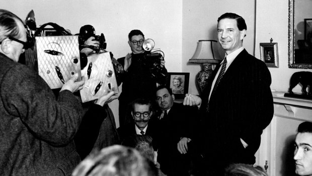 Kim Philby is surrounded by media at his mother's home in West Kensington after his name surfaced in the MacLean-Burgess inquiry, November 1955.