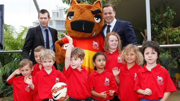 Added spice: Australia's Asian Cup mascot Nutmeg the wombat meets Cup ambassdors Brett Emerton (left), Mark Bosnich and young football fans.