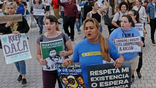 Protesters chant slogans against President Donald Trump's executive order on immigration on Thursday.