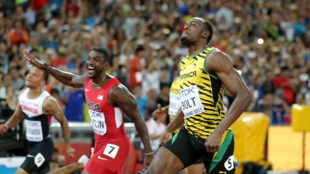 Jamaica's Usain Bolt (right) wins the 100m ahead of Justin Gatlin.