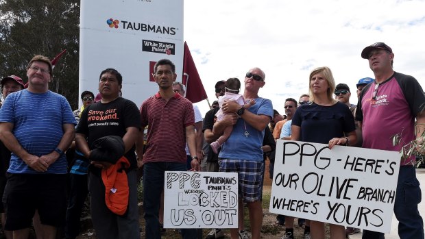 Some of the PPG employees who have been locked out of work since August attend a meeting in front of the company's premises in Villawood. 