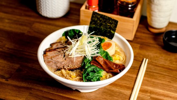 The menu's eight bowls of ramen are dominated by tori paitan broths, a rich chicken base, pictured here topped with charred pork belly.