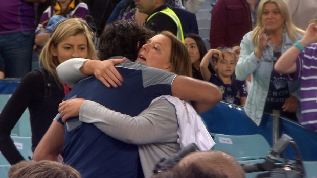 Gentleman: Johnathan Thurston hugs Cameron Smith's wife, Barbara, after the 2017 NRL grand final.