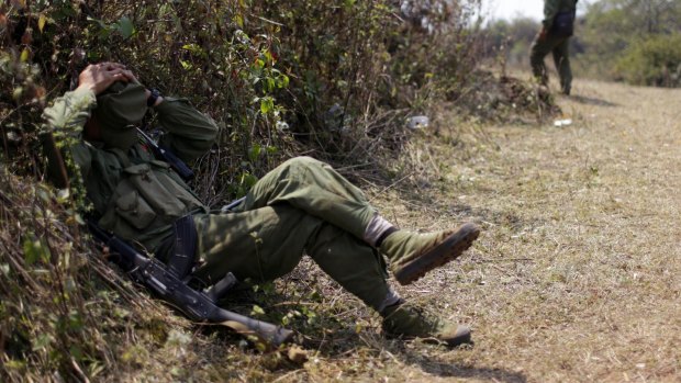 A rebel soldier rests near a military base in Kokang last week.