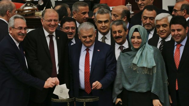 Turkey's Prime Minister, Binali Yildirim, centre, during Turkey's parliamentary debate proposing amendments to the country's constitution.