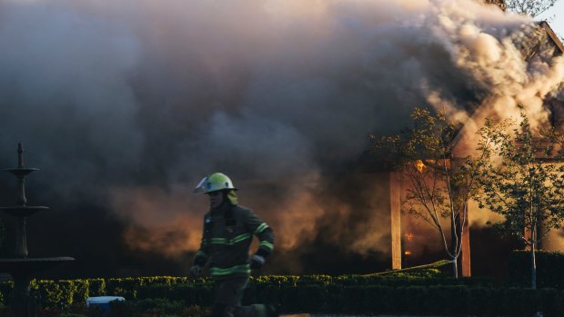 Emergency services work to extinguish the fire on Thursday