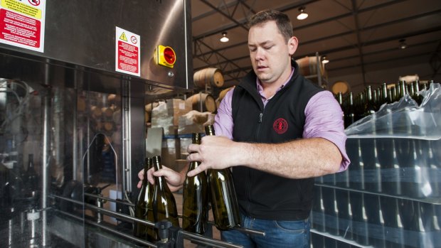 Eden Road Wines assistant wine maker Mike Lloyd bottles the 4 Tonne Project Wines.