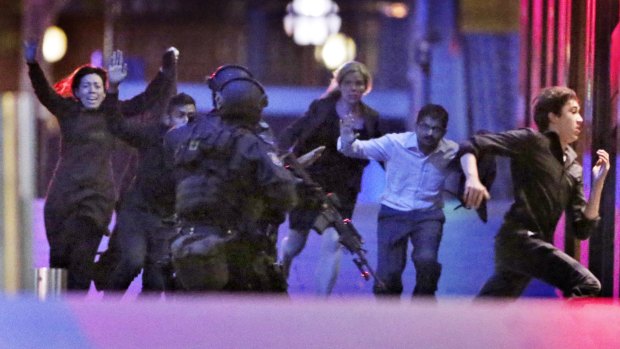 The moment five hostages fled the Lindt cafe. 
