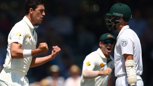 Full rewards: Mitchell Starc celebrates the wicket of Stephen Cook during day one of the First Test.