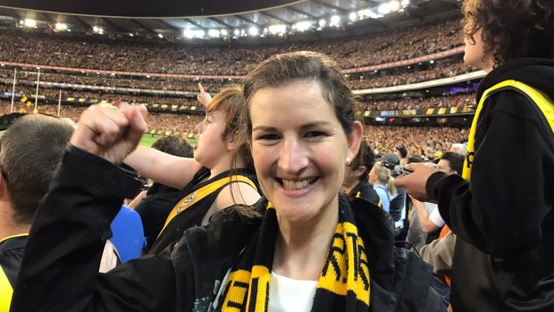 Greens MP Ellen Sandell cheers on Richmond after accepting free tickets to the game.