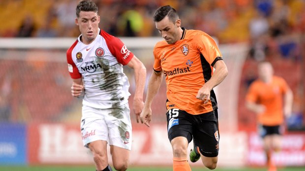 On the run: Manuel Arana breaks away from the Wanderers defence.