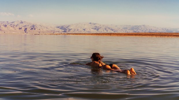 Keep your face out of the water: Swimming in the Dead Sea.