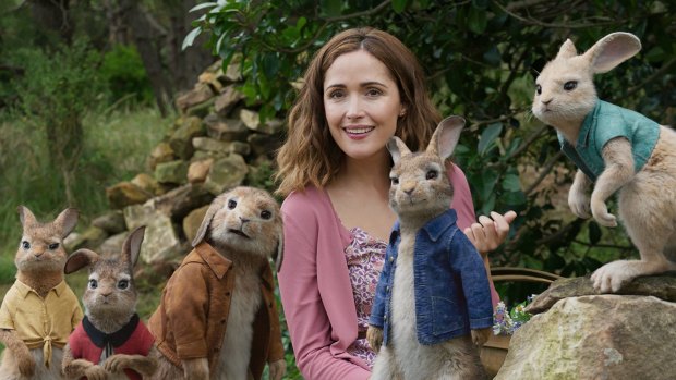 Rose Byrne with characters, from left, Mopsy, voiced by Elizabeth Debicki, Flopsy, voiced by Margot Robbie, Benjamin, voiced by Colin Moody, Peter Rabbit, voiced by James Corden and Cottontail, voiced by Daisy Ridley in a scene from Peter Rabbit.