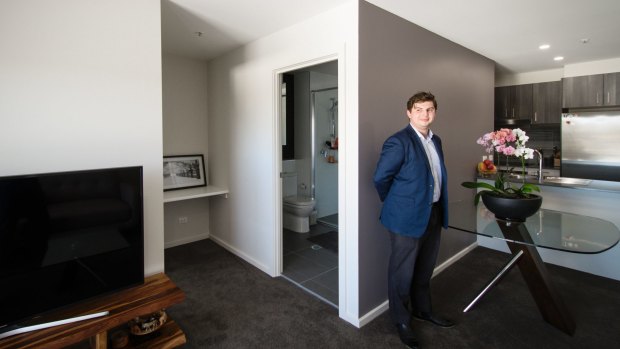 James Lara in his 57-square-metre apartment in Greenway. 