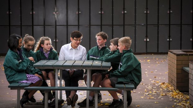 Fairhills High School acting assistant principal Adrienne Tanner with year 7 students. The school is testing out a program to help students resist peer pressure.   