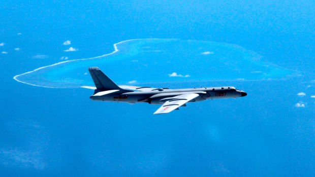 A Chinese H-6K bomber patrols the islands and reefs in the South China Sea.