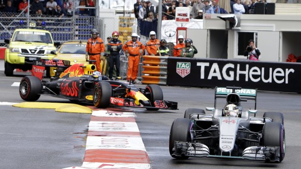 Lewis Hamilton for Mercedes leads Red Bull's Daniel Ricciardo in Monaco.