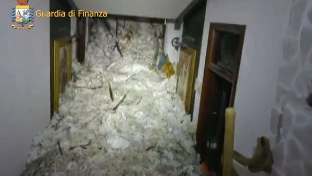 Snow and debris spills inside the Rigopiano Hotel, near Farindola, after an avalanche.