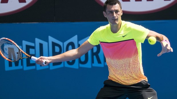 Safely through: Tomic in action in Melbourne last month.