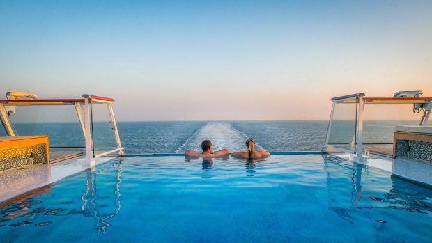 Couple enjoy the view from the Infinity Pool on-board the Viking Star.