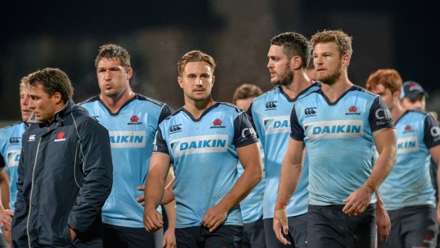 Dejected: The Waratahs following their 29-10 loss to the Crusaders in Christchurch.