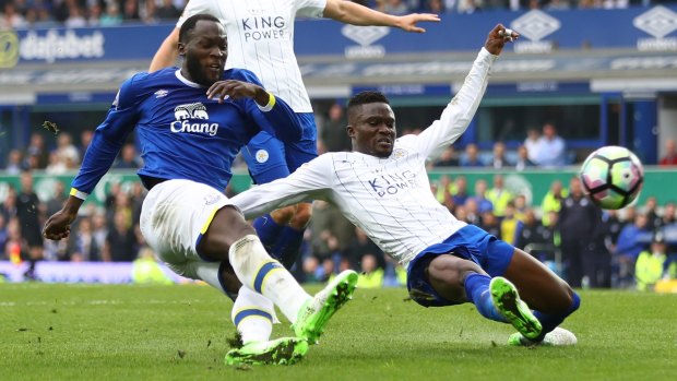 Everton's Romelu Lukaku is challenged by Leicester's Daniel Amartey.
