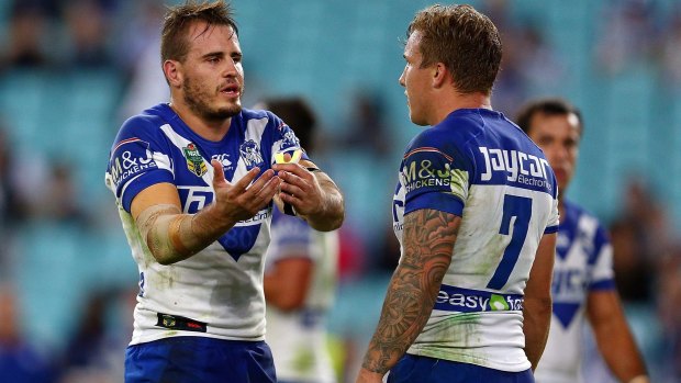 Gone to the dogs: Josh Reynolds and Trent Hodkinson have words during the Canterbury's loss to Wests Tigers on Friday night.