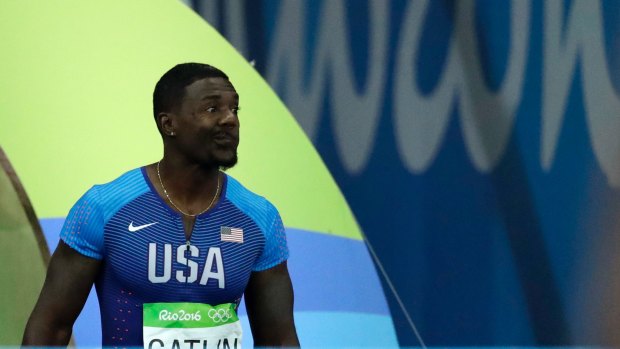 United States' Justin Gatlin makes a face as he is booed when entering the stadium for the men's 100m final at the Rio Olympics.