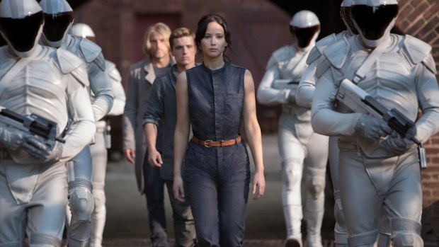 Jennifer Lawrence takes the totalitarian nightmare movie into new, feminine territory in <i>The Hunger Games</i>.