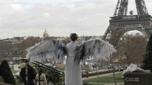 Winged protest: Australian art activists Climate Guardian Angels are hoping to get around the post-terror ban on protests in Paris.