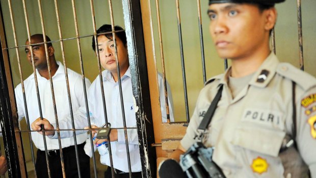 Sukumaran (left) and Chan behind bars.