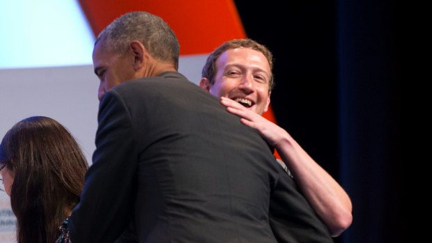 Buddies: President Barack Obama and Facebook CEO Mark Zuckerberg embrace on stage at an event at California's Standford University in June.