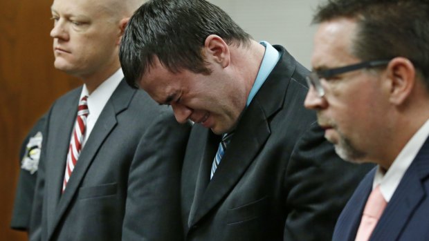 Daniel Holtzclaw cries as he stands in front of the judge after the verdicts were read out.
