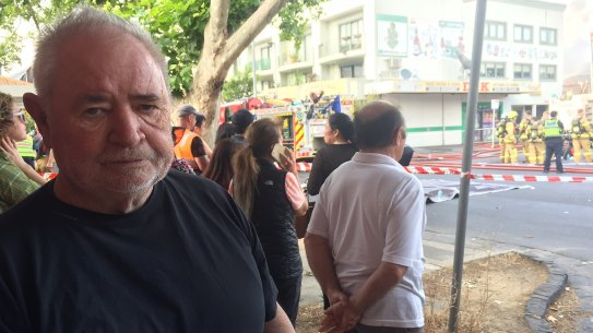 Les Twentyman at the scene of the fire where thousands of books and toys went up in smoke.