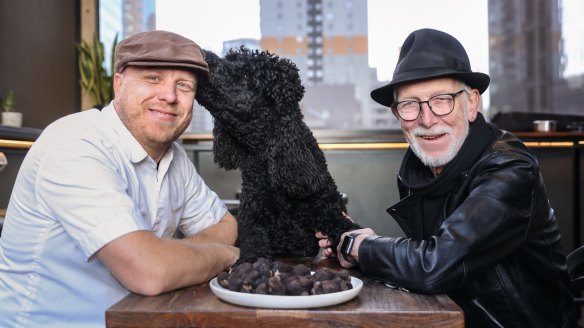 Bomba chef Jesse Gerner with Truffle Melbourne founder Nigel Wood and Pompy the truffle dog, showing off the season's first truffles.