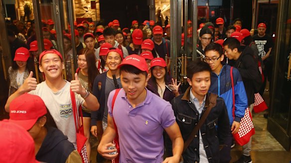 A large crowd piles into David Jones just after the announcement of the start of the Boxing Day sales at the Castlereagh Street store in Sydney.