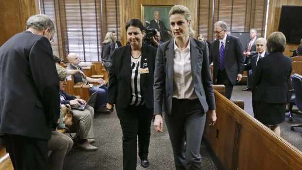 Sportscaster and television host Erin Andrews, centre, leaves the courtroom after her lawsuit was given over to the jury.