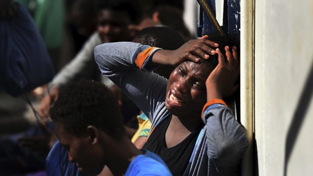 Refugees continue to flood into Europe. Pictured: a woman aboard a European ship after being rescued in the Mediterranean. 