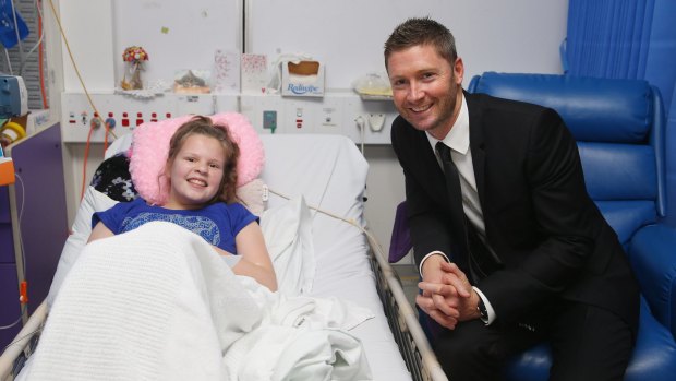 Helping hand: Michael Clarke poses with Jasmine at Sydney Children's Hospital.