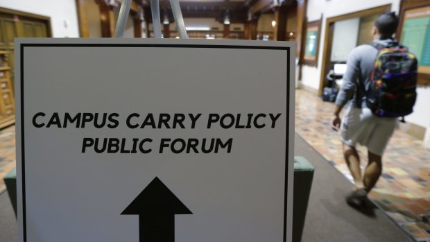 A public forum at the University of Texas campus on how to implement a new law allowing students with concealed weapons permits to carry firearms into class and other campus buildings.