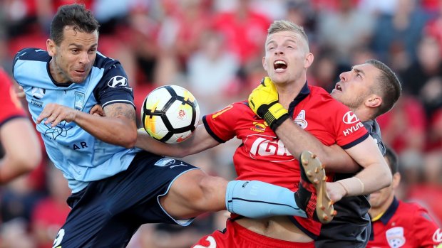 Tangle: Bobo of Sydney FC clashes with Jordan Elsey.