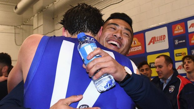 Lin Jong congratulates Tom Boyd in the rooms on Friday night.
