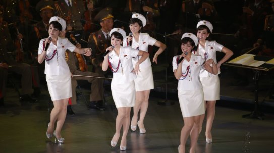FILE - In this  Sunday, Oct. 11, 2015, file photo, members of North Korea's Moranbong band sing and dance during a joint performance with the State Merited Chorus in Pyongyang, North Korea. North Korea's Moranbong band, an all-female band formed by North Korean leader Kim Jong Un, has canceled its concerts in Beijing and abruptly left the Chinese capital for unknown reasons. (AP Photo/Charles Dharapak, File)