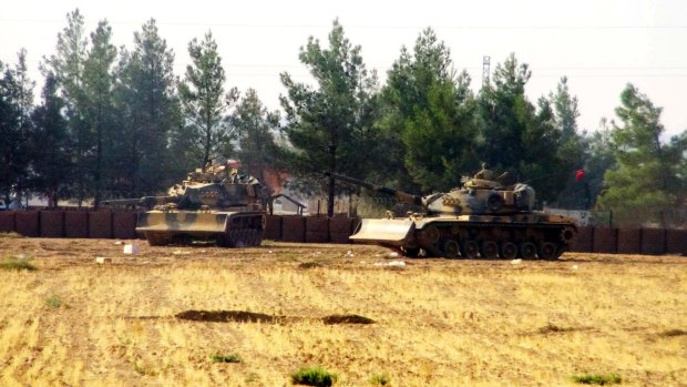 Turkish army tanks are stationed near the border with Syria, in Karkamis, Turkey.