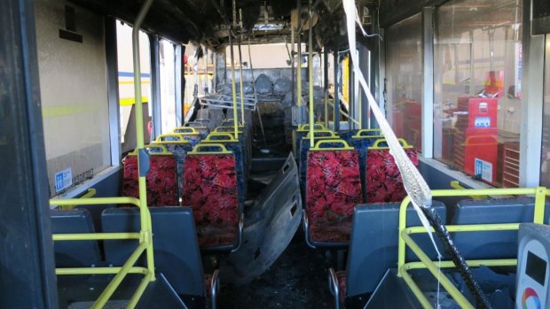 The interior of the destroyed bus, with the Opal reader in the right foreground.
