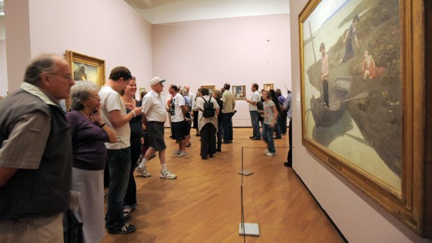 Visitors  at the 2010 Masterpieces from Paris exhibition at the National Gallery of Australia.  